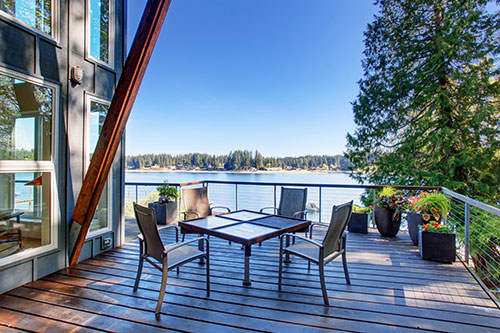 Photo of a patio deck overlooking a beautiful lake in the pacific northwest